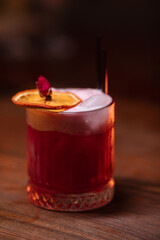cocktail in a restaurant, professional shooting. a cocktail glass filled with a bright drink, decorated with additional decor. professional photography of a drink