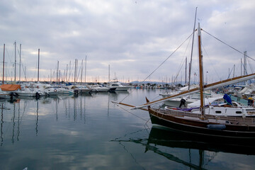 Fototapeta premium fishing boats in the port of Alghero, Boats and fishing nets in the port of Alghero. Sardinia. Italy