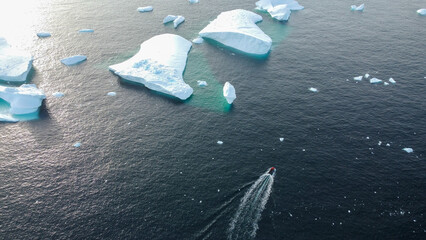 Motorboat in the Southern Ocean, Antarctica. Little boat in the big Ocean. Track from the boat in the frozen ocean. © Oleksandr Matsibura