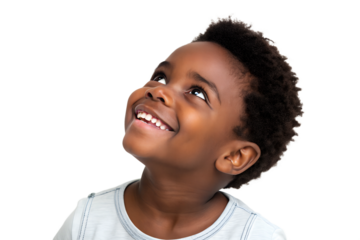 Young boy smiling and looking up with joy