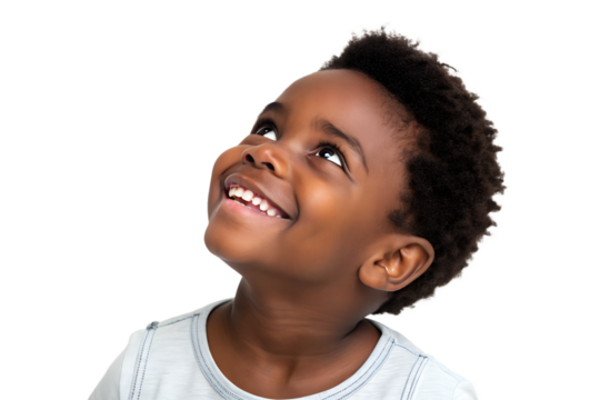 Young boy smiling and looking up with joy