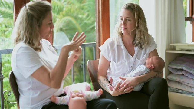 Baby class, breastfeeding and midwife with a mother in her home for prenatal education or wellness. Healthcare, medical and nurse teaching a woman parent how to feed her newborn infant in a hospital