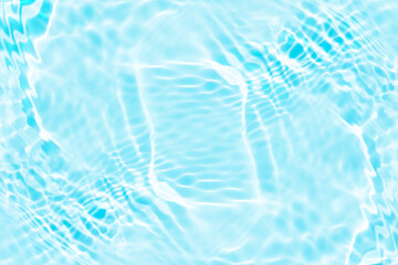 Blue water with ripples on the surface. Defocus blurred transparent blue colored clear calm water surface texture with splashes and bubbles. Water waves with shining pattern texture background.