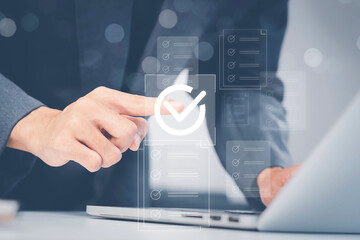 Businessman touching approved document icon on digital documents for approve business project...