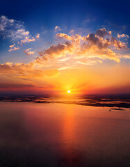 Fototapeta premium Clear blue sky in a sunset. glowing golden cirrus. view of sky during sunset