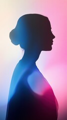 silhouette of a woman against a backlight, backlight casting vibrant shades of soft blue and pink