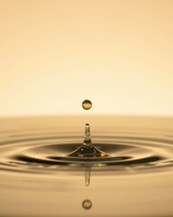 Golden Liquid Droplet Impacting Still Water