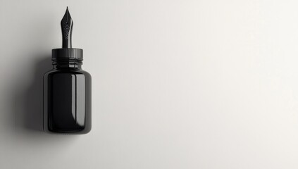 Black ink bottle, nib, white background, copy space, stationery
