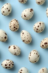 Obraz premium Quail eggs pattern, pastel blue background, food photography, spring