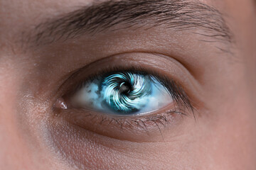 Obraz premium Hypnosis. Hypnotic spiral and clouds in man's eye, closeup