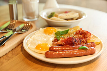 Delicious breakfast served on wooden table in restaurant, closeup