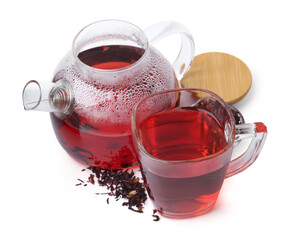 Tasty hibiscus tea in glass cup and teapot isolated on white