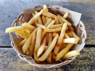 French fries served in a bamboo basket