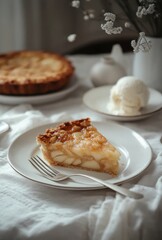 Delicious apple pie slice served with vanilla ice cream and garnished with fresh flowers on a rustic table setting for a cozy dessert experience