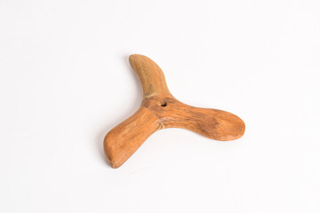 Traditional wooden massage tool isolated on white background.