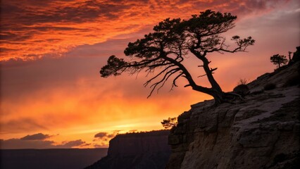 Dramatic Cliff Silhouette: Vibrant Sunset Photography for Websites