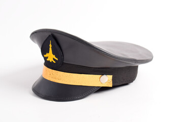 Airline pilot cap with gold emblem, isolated on a white background