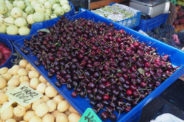 Fresh cherries and other fruits displayed at a local market