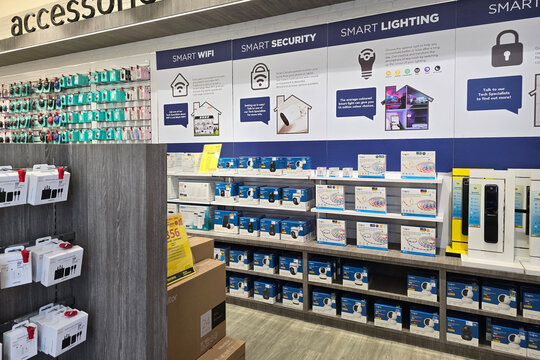 Penang, Malaysia - Jan 24, 2025: Smart home accessories section inside Harvey Norman store, featuring smart WiFi devices, security cameras, and smart lighting solutions.