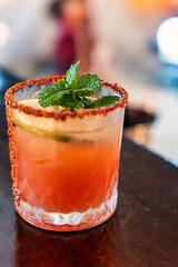 A Refreshing and Colorful Cocktail with a Mint Leaf and a Citrus Garnish for that Perfect Sip