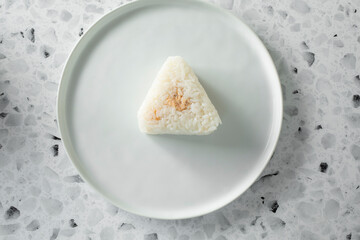 A top down view of a salmon onigiri.