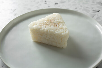 A closeup view of a tuna mayo onigiri.