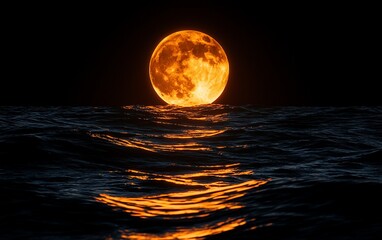 Orange full moon rising over ocean waves at night; mystical background