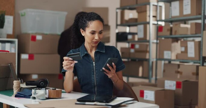 Smile, woman and credit card with phone at warehouse for online shopping, purchases and bank details. Female person, mobile and transaction with ecommerce sales, investment and checkout for inventory