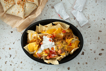 A top down view of a restaurant style nachos.