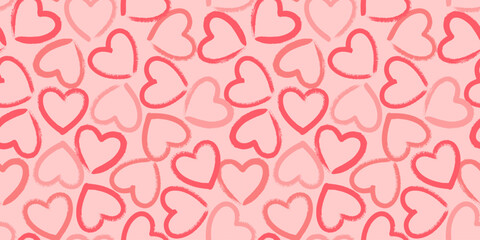 Seamless pattern with crayon hand drawn red hearts on pink background. Hand painted ink brush strokes. Vector grunge romantic backdrop.