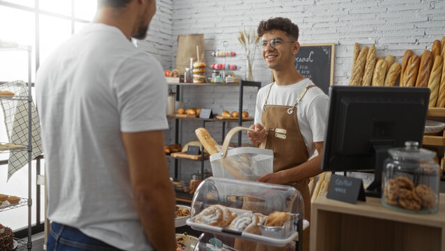 Two men interacting at a bakery counter with one acting as a customer and the other as a baker in a cozy indoor shop setting