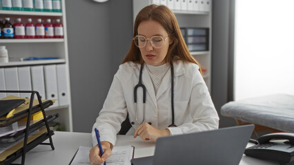 Woman doctor in clinic writes notes at desk with laptop in professional medical setting highlighting attentive care and expertise.