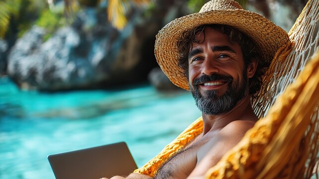 A joyful man in a straw hat lounges in a hammock with a laptop by the sea, exuding productivity and relaxation. Tropical getaway concept.