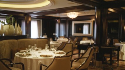 Luxury restaurant interior blurred with elegant furnishings and ambient lighting, capturing defocused bokeh atmosphere, a sophisticated dining experience indoors with a cozy ambiance.