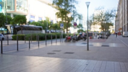 Blurred urban street scenery in marseille, france, capturing a defocused background with bokeh effect highlighting an outdoor scene with minimal details.