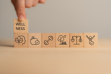 Holistic Wellness Concept. Wooden block with wellness icons, health care ,including mental...