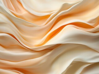 Abstract flowing fabric background with soft peach and cream colors.