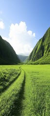 Fototapeta premium Lush green valley surrounded by towering mountains under a bright blue sky, with a winding path leading through the vibrant landscape.