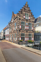  Typical houses with red and white shutters on the window in the fortified city Gorinchem along the bridge and canal Linge.