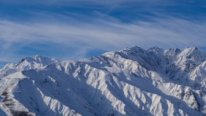 晴天の空と雪の北アルプス　長野県白馬村