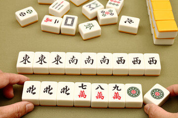 Chinese mahjong on green background 