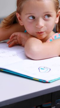 Disabled schoolgirl studying in classroom