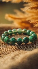 Elegant green jade bracelet displayed on natural fabric background jewelry photography outdoor setting close-up view serenity and style