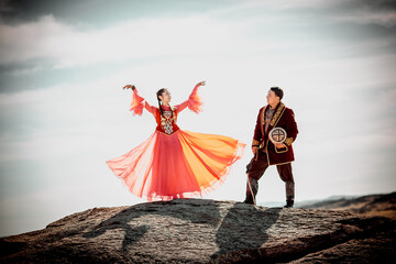Kazakh woman and man in national costumes