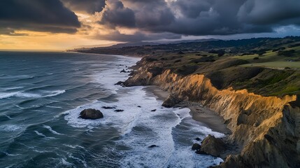 Obraz premium Coastal cliffs at sunset, dramatic ocean waves crashing against rugged rocks, vibrant sky reflecting warm colors, serene atmosphere.