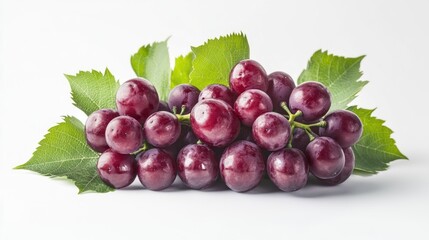 Fototapeta premium A bunch of fresh grapes with green leaves on a white surface, ideal for food or wine related concepts