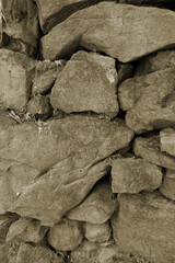 Light soft pastel pale dusty brown beige background. Stone wall surface texture. For design