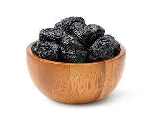 Dried prunes in wooden bowl isolated on white background. clipping path.