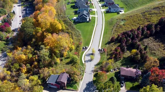 Stunning aerial shot of Bridgeville, PA, with colorful fall foliage, orange and yellow leaves adorning trees and streets, capturing the essence of autumn in Allegheny County.
