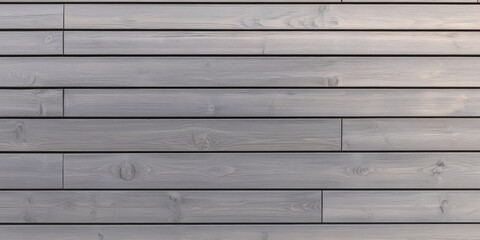 Wooden wall planks display a gray finish for modern interior design applications